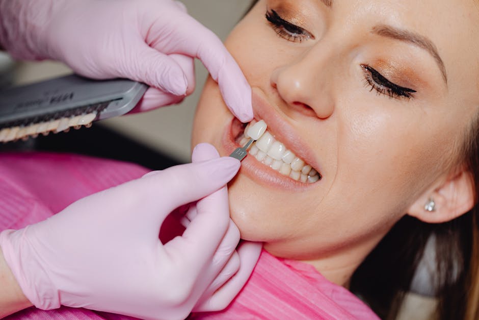 Aesthetic restoration being matched to a patient's front teeth