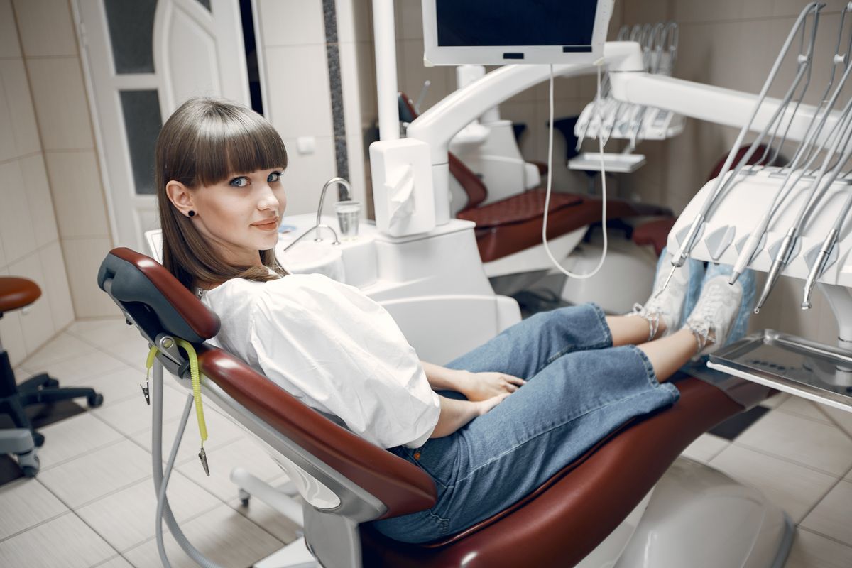 painless root canal Belapur — relaxed patient smiling in the dental chair at La Pearl Dental Boutique, Sector 15 Navi Mumbai