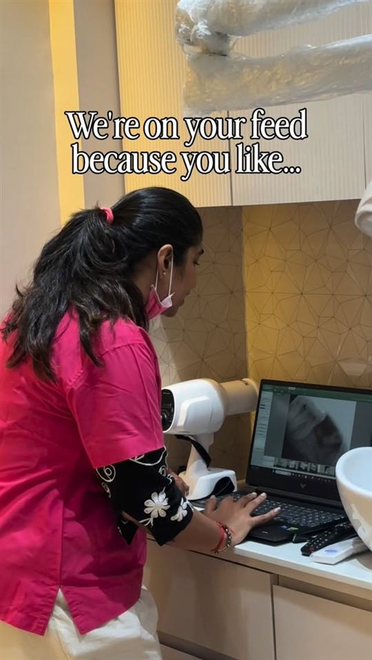 A team member reviewing a digital dental X-ray at La Pearl Dental Boutique