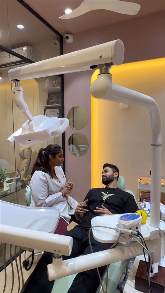 Dr. Shriya talking a patient through treatment in the dental chair