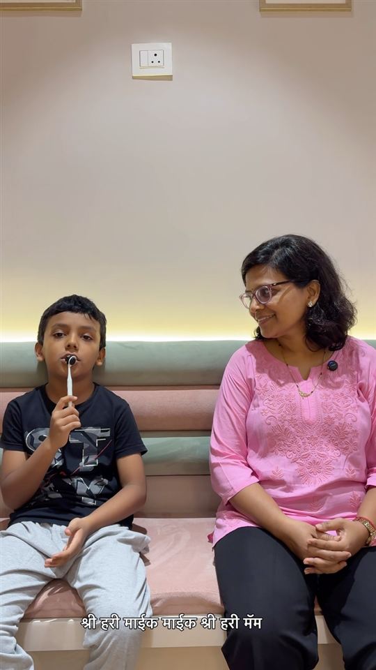 A young patient and his mother after a kids' dentistry visit in CBD Belapur