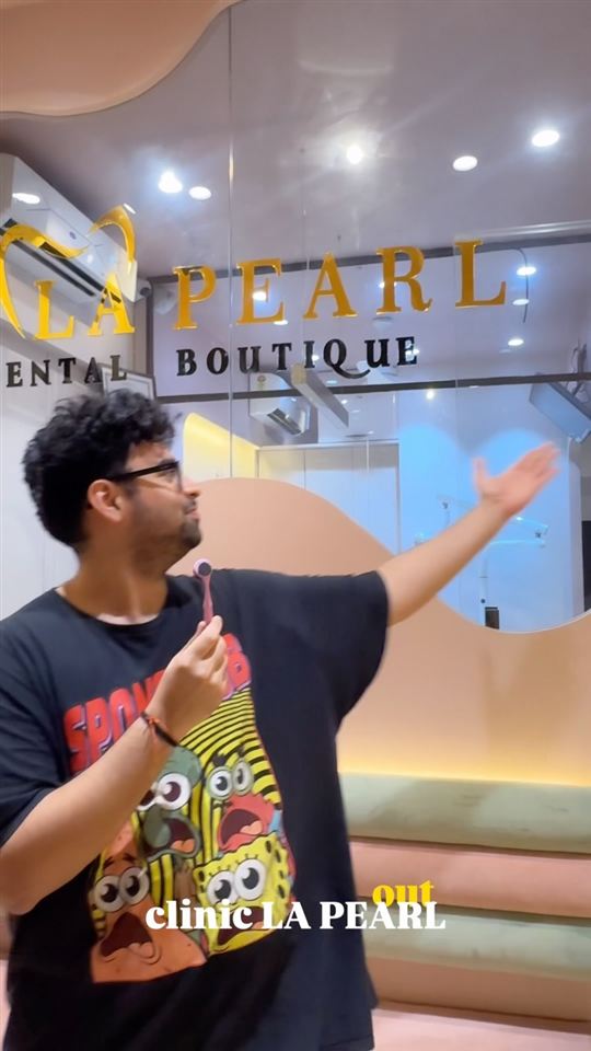 A patient showing the reception area at La Pearl Dental Boutique, Sector 15
